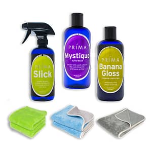 Three bottles of Prima Car Care products are displayed with a blank background and three microfiber towels