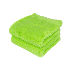 A green microfiber towel is displayed with a blank background